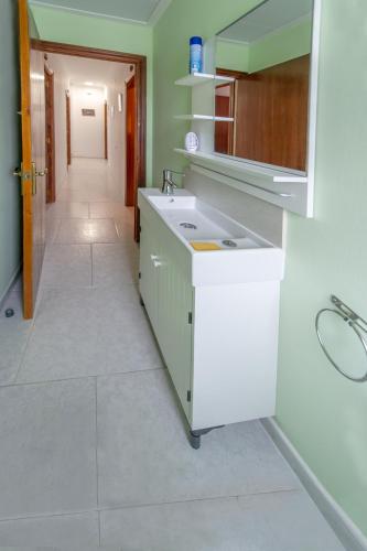 a bathroom with a sink and a mirror at Casa rural LAS TABLAS in Riópar
