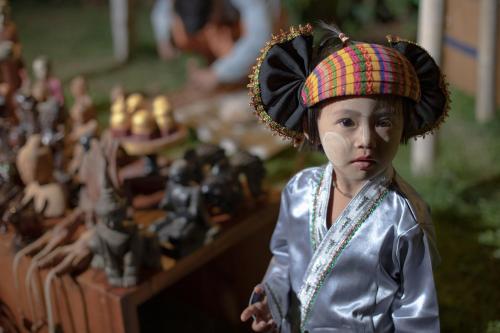 a figurine of a girl with a hat on at Sanctum Inle Resort in Nyaung Shwe