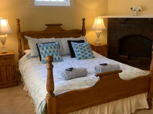 a bedroom with a large bed with two pillows on it at Adelaide Style Accommodation - City to Beach - Free WIFI - Free 3 car parking - Great location in Adelaide