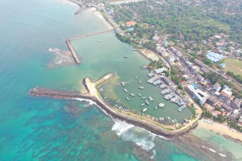 an aerial view of a harbor with boats in the water at Tranquil in Hikkaduwa