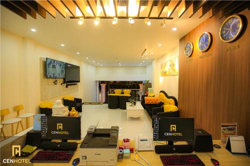 a room with two computers on a table in a store at Cen Hotel in Vung Tau