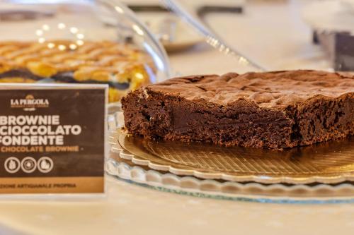 a chocolate cake sitting on top of a table at Hotel Ristorante La Pergola in Magliano Sabina