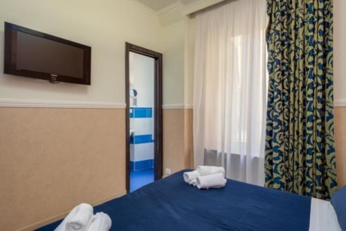 
A bed or beds in a room at Mocenigo Vatican Suites

