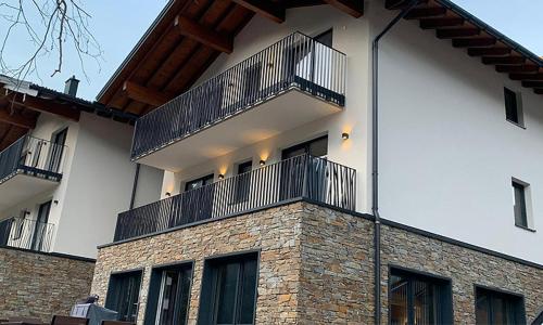 a building with two balconies on top of it at Alpenchalet Montafon in Gaschurn