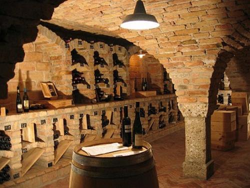 a wine cellar with a wall of wine bottles at Gasthof Hotel Doktorwirt in Salzburg
