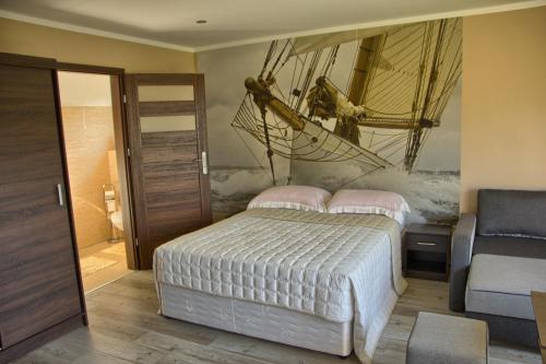 Un pat sau paturi într-o cameră la Nadmorskie Słońce