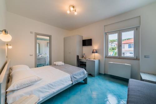Een bed of bedden in een kamer bij Hotel Corallo Circeo