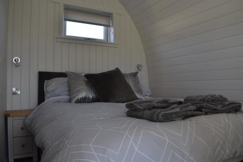 A bed or beds in a room at Grantown Caravan Park