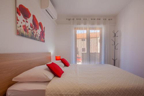 Кровать или кровати в номере Apartments Eva