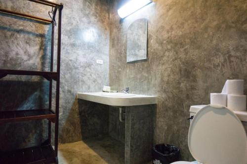 a bathroom with a sink and a toilet at Chang Cliff Resort in Ko Chang