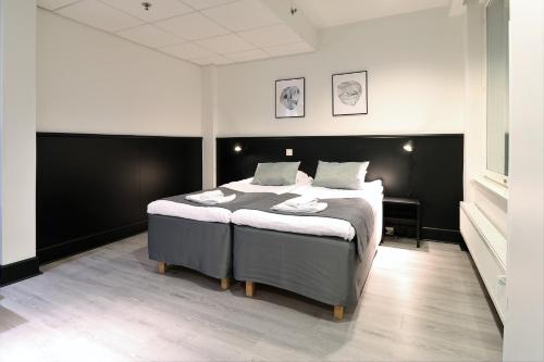 Кровать или кровати в номере Forenom Aparthotel Tampere