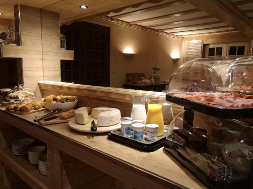 a kitchen with a counter with food on it at La Sapinière St Lary Soulan in Saint-Lary-Soulan