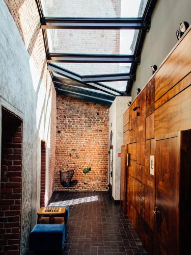 a room with a brick wall and a skylight at Pokoje Gościnne WIDNOKRĄG in Sandomierz