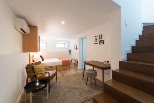 a hotel room with a bed and a desk at Apartment Boavista Roundabout by Sweet Porto in Porto