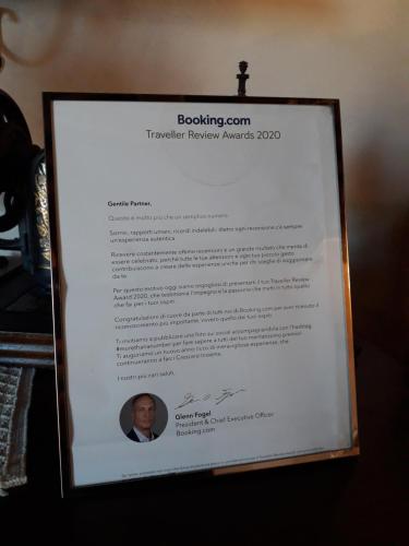 a framed picture of a document with a man at Il vecchio frantoio in Panicale