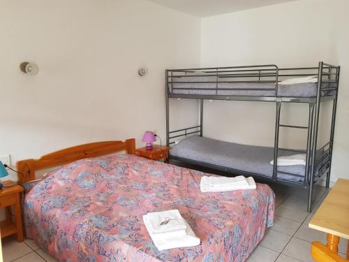 Postel nebo postele na pokoji v ubytování Le Mas de Mon Pere