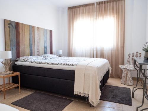 Ένα ή περισσότερα κρεβάτια σε δωμάτιο στο Casa Olina