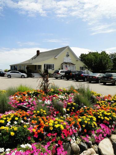 a field of flowers in front of a building at Sea Chambers in Ogunquit