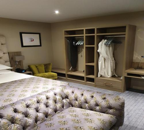 a hotel room with a bed and a closet at Boulevard Hotel in Blackpool