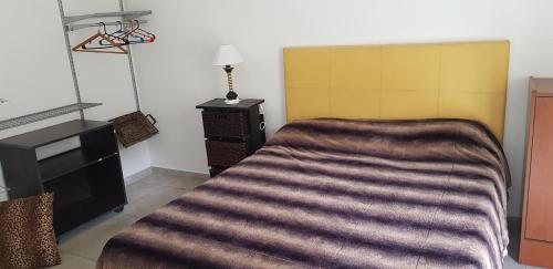 Postel nebo postele na pokoji v ubytování Altos del Lago