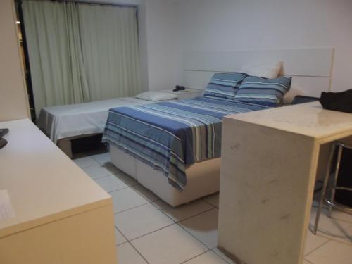 Cama o camas de una habitación en Flat BV no Aparthotel Beach Class EXECUTIVE - Apto 507 - na Beira-Mar do Recife