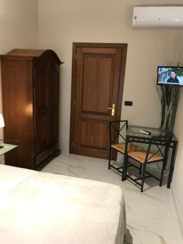 Una cama o camas en una habitación de Hotel Paola