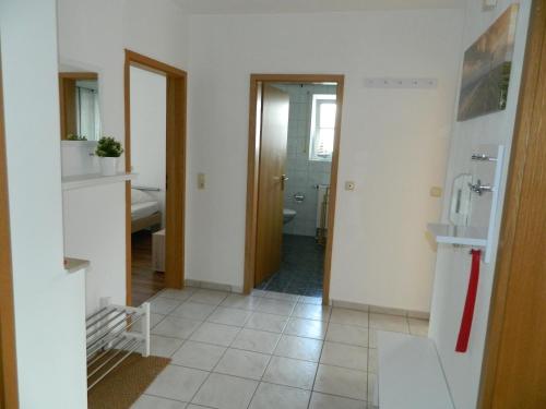 a room with a bathroom with a toilet and a sink at Ferienwohnung Fränkisches Seenland - FeWo Antje in Mitteleschenbach