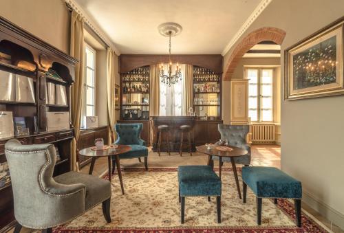 a bar with chairs and tables in a room at The Lake Como Villa in Menaggio