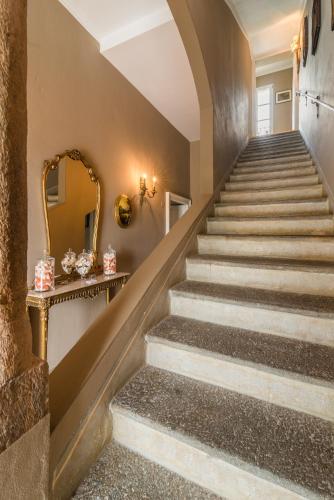 a set of stairs in a house with a mirror at The Lake Como Villa in Menaggio