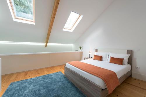 Säng eller sängar i ett rum på Apartment Firehouse by Sweet Porto - Free Parking