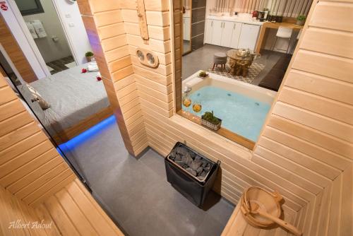 an overhead view of a tiny house with a hot tub at Yosefdream Luxury suites in Had Nes