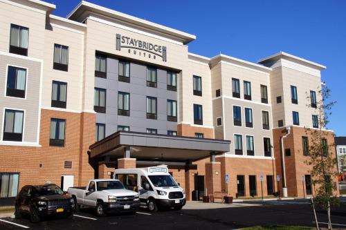a hotel with cars parked in front of it at Staybridge Suites Charlottesville Airport by IHG in Charlottesville