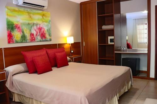 Ένα ή περισσότερα κρεβάτια σε δωμάτιο στο Hotel Jardin De Iguazu