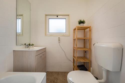 a bathroom with a toilet and a sink at 3 bedroom apt near Av. Liberdade in Lisbon