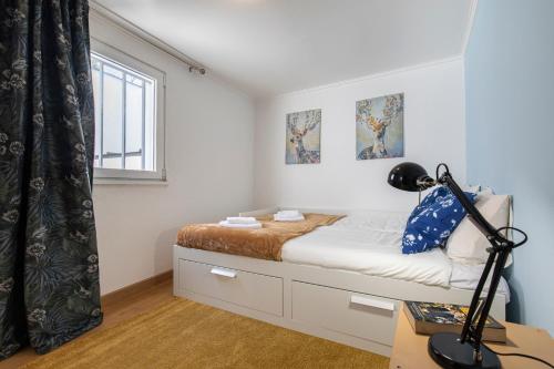 Posteľ alebo postele v izbe v ubytovaní 3 bedroom apt near Av. Liberdade