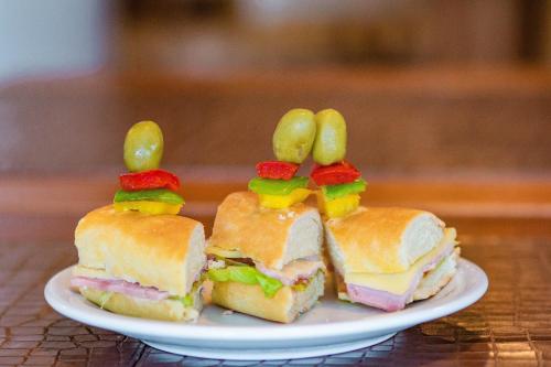 a plate with a sandwich with bunny ears on it at Real Praia Hotel in Aracaju