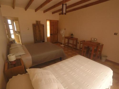 เตียงในห้องที่ Casa Ckelar Atacama