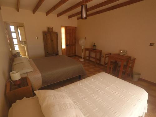 Postel nebo postele na pokoji v ubytování Casa Ckelar Atacama