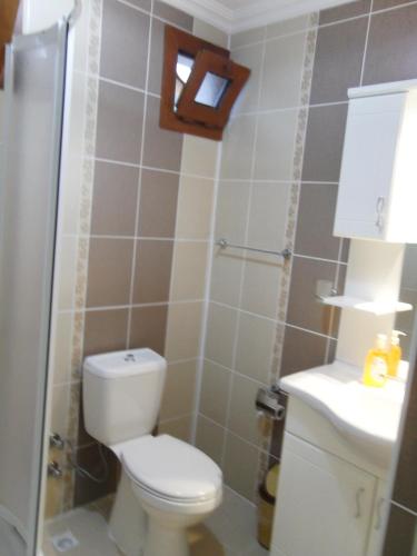 Koupelna v ubytování Sirman Apart Hotel