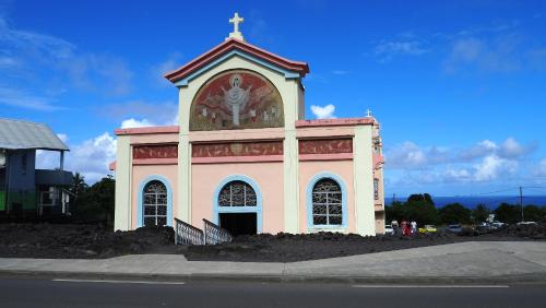 a church with a cross on top of it at Chambres d'hôtes du domaine des doudous in Saint-Pierre