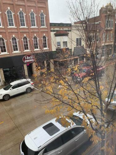 a white car parked in a parking lot in a city at Koreana in Decorah in Decorah