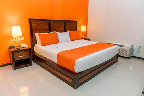 Кровать или кровати в номере Comfort Inn Cancún Aeropuerto