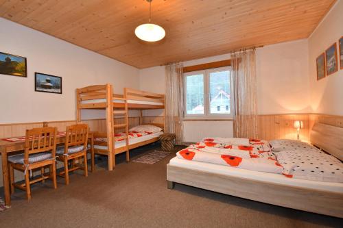 מיטה או מיטות בחדר ב-Chata Horec