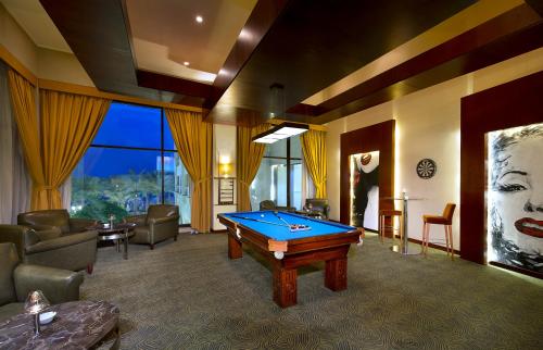 a living room with a pool table in it at InterContinental Aqaba by IHG in Aqaba
