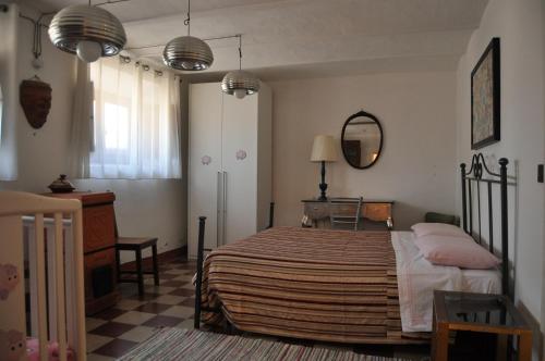 Un pat sau paturi într-o cameră la Villa Salvini
