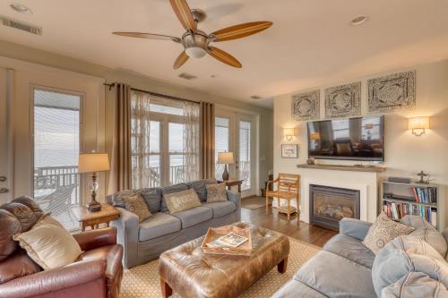 a living room with a couch and a fireplace at Folly 'B' Golly in Folly Beach