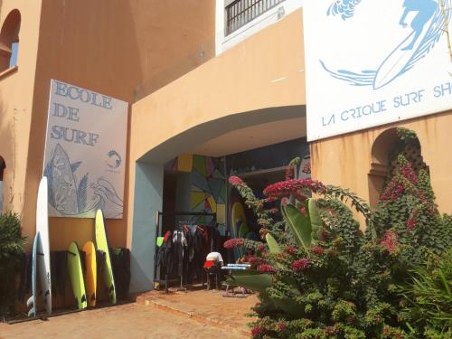 a store with a sign on the side of a building at Villa à Bouznika Bay-plage et golf in Bouznika