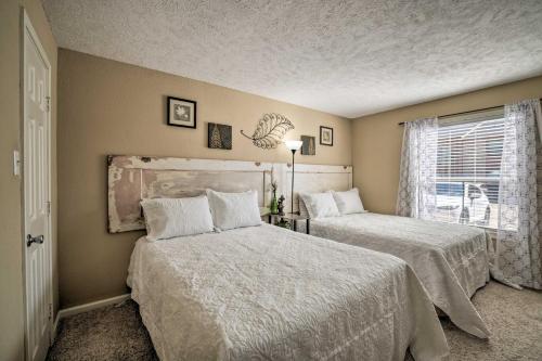a bedroom with two beds and a window at Game Day Retreat with Pool Access 2 Mi to Texas AandM in College Station