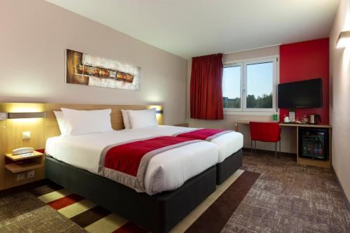 Postel nebo postele na pokoji v ubytování Holiday Inn - Strasbourg - Nord by IHG