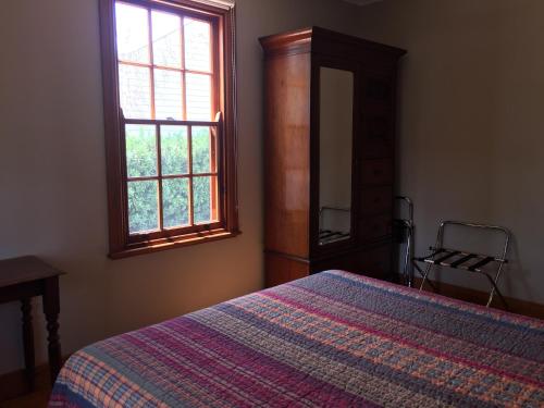 
A bed or beds in a room at Gulgong Telegraph Station
